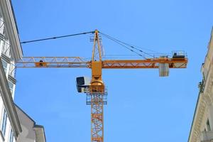 Yellow Construction Crane and Sky in Background photo