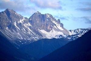 Rocky Peak of the Mountain Covered with Snow - Alps in Austria photo