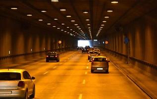 Cars Driving in Tunnel - Perspective photo