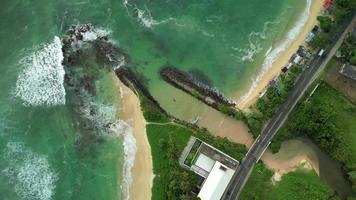 Sri Lanka coast with road nearby Midigama by drone video