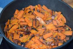 Carrots and Bacon Frying together photo