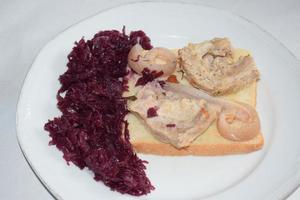 Cooked Bacon and Pork Skin on Bread with Red Cabbage photo