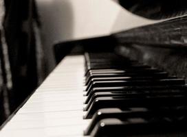 Black and white piano keyboard. Piano keyboard monochrome close-up picture. Retro style picture. photo
