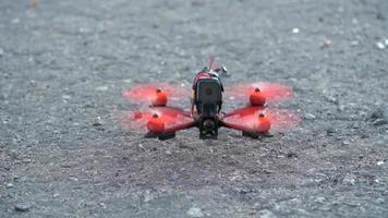 FPV freestyle drone getting ready to take off. Slow motion video