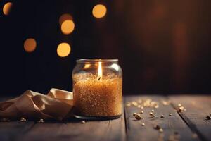 Blurred Background With Golden Candle And Wooden Table photo