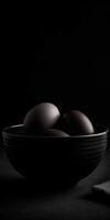 black eggs in bowl photo