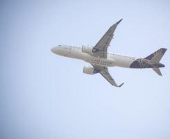 New Delhi, India, April 16 2023 - Vistara Airbus A320 neo take off from Indra Gandhi International Airport Delhi, Vistara domestic aeroplane flying in the blue sky during day time photo