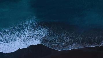 Aerial view of surface of the Atlantic Ocean with reflection of sunlight at sunset video