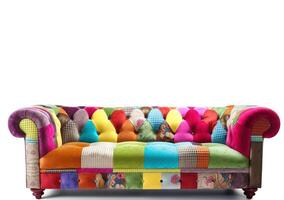 Chesterfield sofa from multi-colored fabric, patchwork, on a white background. . photo