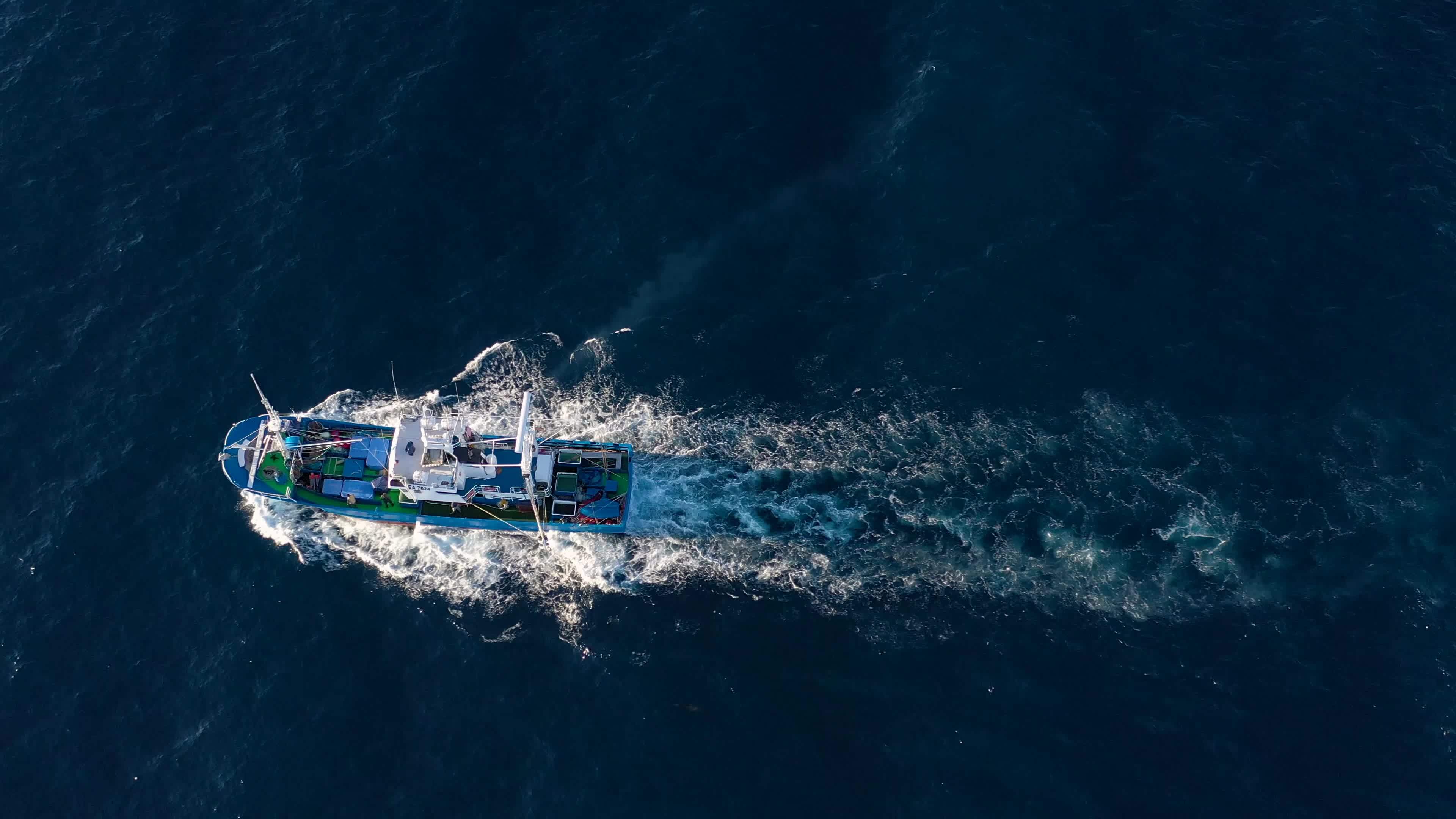 Top view of a fishing boat sailing in the Atlantic Ocean 23143850 Stock