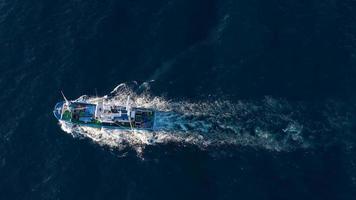 Top view of a fishing boat sailing in the Atlantic Ocean video