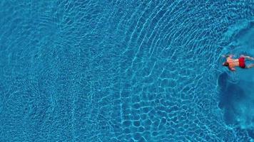 Topview from a drone over the surface of the pool video