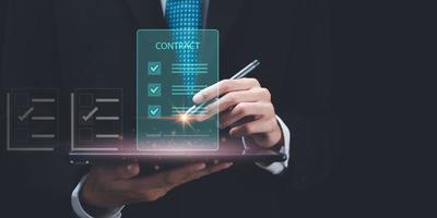 man checking contract documents online ,handle business documents and agreements, business cooperation and contract signing ,Inspection agrees on quality assurance ,Approval of checklist documents photo
