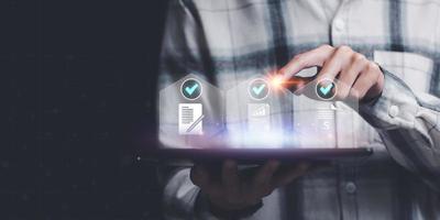 checkbox to conduct opinion and quality surveys or satisfaction , quality inspection ,Qualification for Measurement ,accountant auditing documents ,quality assessment management With a checklist photo