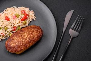 Delicious fried cutlets or meatballs of minced fish with rice photo