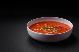 Delicious fresh Ukrainian borscht with beets, carrots and cabbage photo