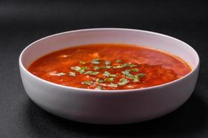 Delicious fresh Ukrainian borscht with beets, carrots and cabbage photo