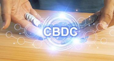 CBDC is a digital currency issued by a central bank. which has the ability to act as a medium to pay for goods and services can maintain value and is an accounting unit of measurement photo