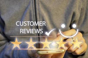 Customers rate service of Businessmen choose to rate 5 stars using smart phone and give five star symbol. Excellent rating. User give rating, feedback, good business network score photo