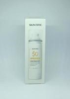 Jakarta, Indonesia - April 21th, 2023 - Skintific sun screen spray spf 50 solar uv block packaging box product object photography isolated on plain white landscape horizontal background. photo