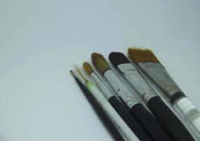 Coloring art paint brush for artist. Watercolor, oil paint, acrylic paint, or gouache painting brushes photo isolated on plain white background.