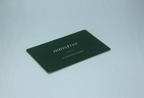 Jakarta, Indonesia - April 21th, 2023 - Innisfree green gift card for point reward exchange. Product photography isolated on plain white background photo