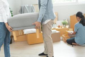 Moving house, relocation. Couple choose design for building new apartment, inside the room was a cardboard box contain personal belongings and furniture. move in the new apartment or condominium photo