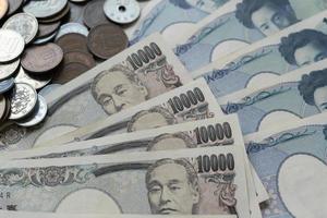 Japanese Yen money. close up of the Japanese yen on hand. currency of Japan that is used to change, buy, sell, accumulate, invest, financial, exchange rate, value, accounting, international exchange photo