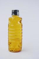 yellow sunflower oil bottle on white background photo