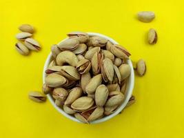 Roasted salted pistachio nuts in nutshell photo