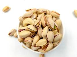 Roasted salted pistachio nuts in nutshell photo