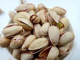 Roasted salted pistachio nuts in nutshell photo