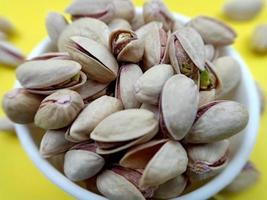 Roasted salted pistachio nuts in nutshell photo