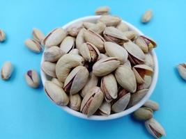 Roasted salted pistachio nuts in nutshell photo