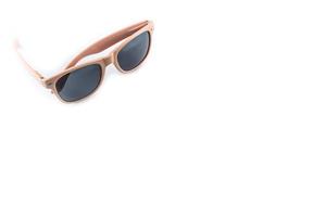 pink sunglasses on white background photo