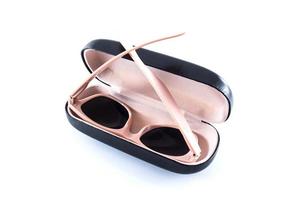 pink sunglasses in black opened case photo