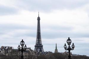 Close up view of The Eiffel Tower head from pont alexander III bridge . photo