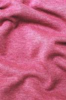 burgundy viva magenta wrinkled plush fabric background texture, soft material pattern photo