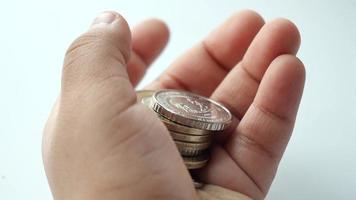 child hand pick coins closeup video