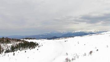 Beautiful Winter Mountain Landscape on a Cloudy Day Aerial Shot. Ski Resort Top View. video