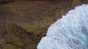 Top view of the desert beach on the Atlantic Ocean. Coast of the island of Tenerife. Aerial drone footage of sea waves reaching shore video