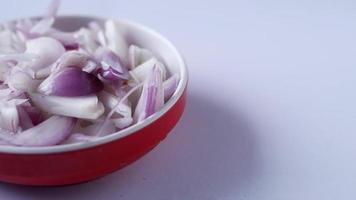 red onion in a bowl on table video