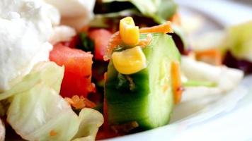 fresh vegetable salad bowl on table, video