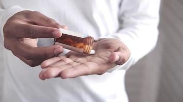 top view of man hand taking medicine from pill container video