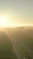 Hazy morning light over traffic on a highway video