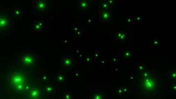 motion glowing particles of green light flying in the dark abstract background. High quality 4k footage video