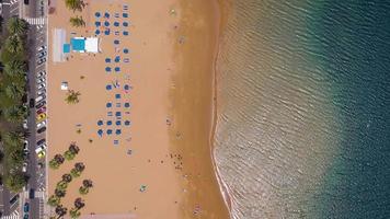 Top view of Las Teresitas beach, road, cars in the parking lot, golden sand beach, Atlantic Ocean. Paradise day at the beach. Tenerife, Canary Islands, Spain video