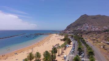 Top view of Las Teresitas beach, road, cars in the parking lot, golden sand beach, Atlantic Ocean. Paradise day at the beach. Tenerife, Canary Islands, Spain video