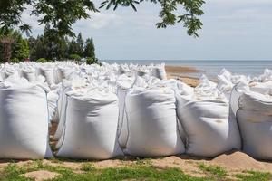Big bags of sea sand on the beach. photo