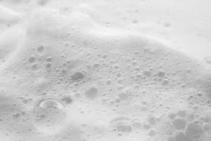 Abstract white soap foam bubbles texture background photo